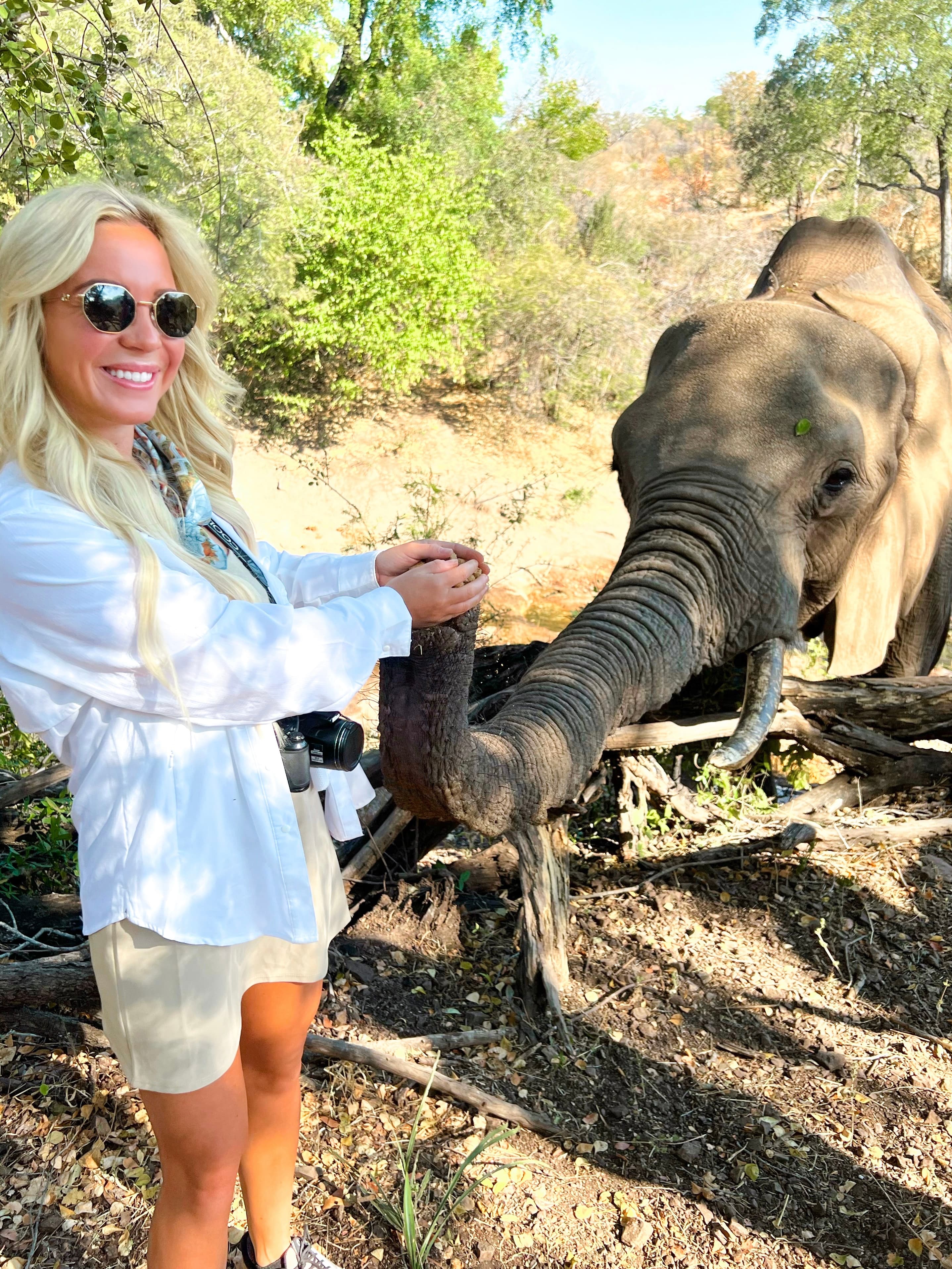 Travel advisor posing with an elephant