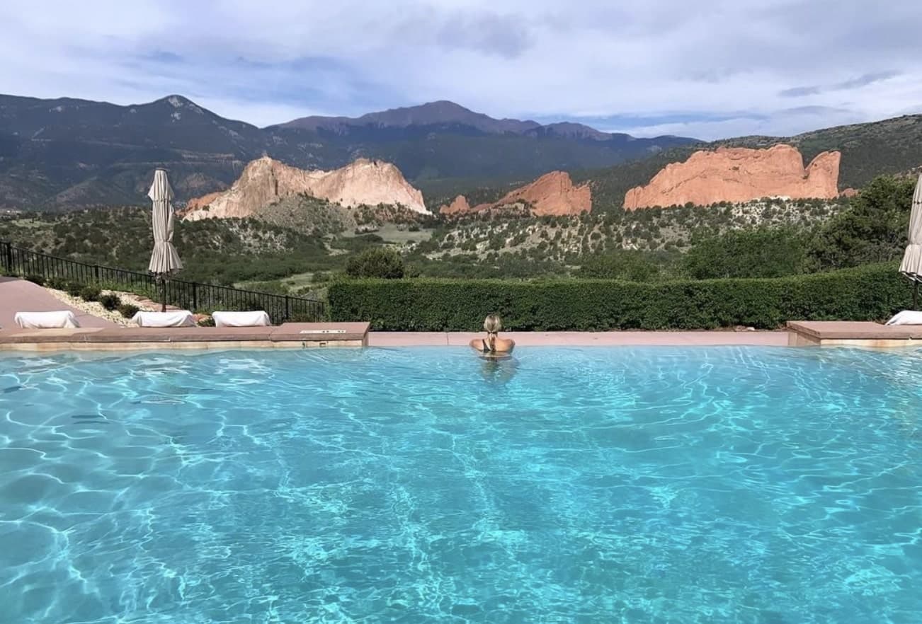 Picture of Sarit in pool at Garden of the Gods Resort & Club with beautiful, natural views in the distance.