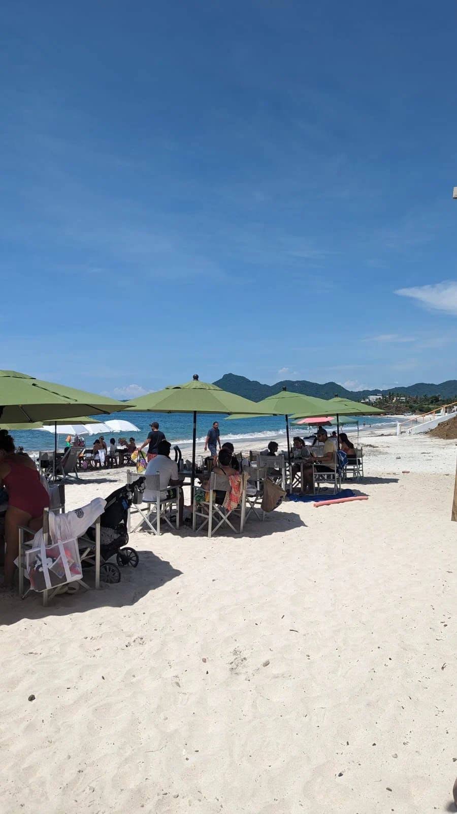 A dining area on the beach during the daytime