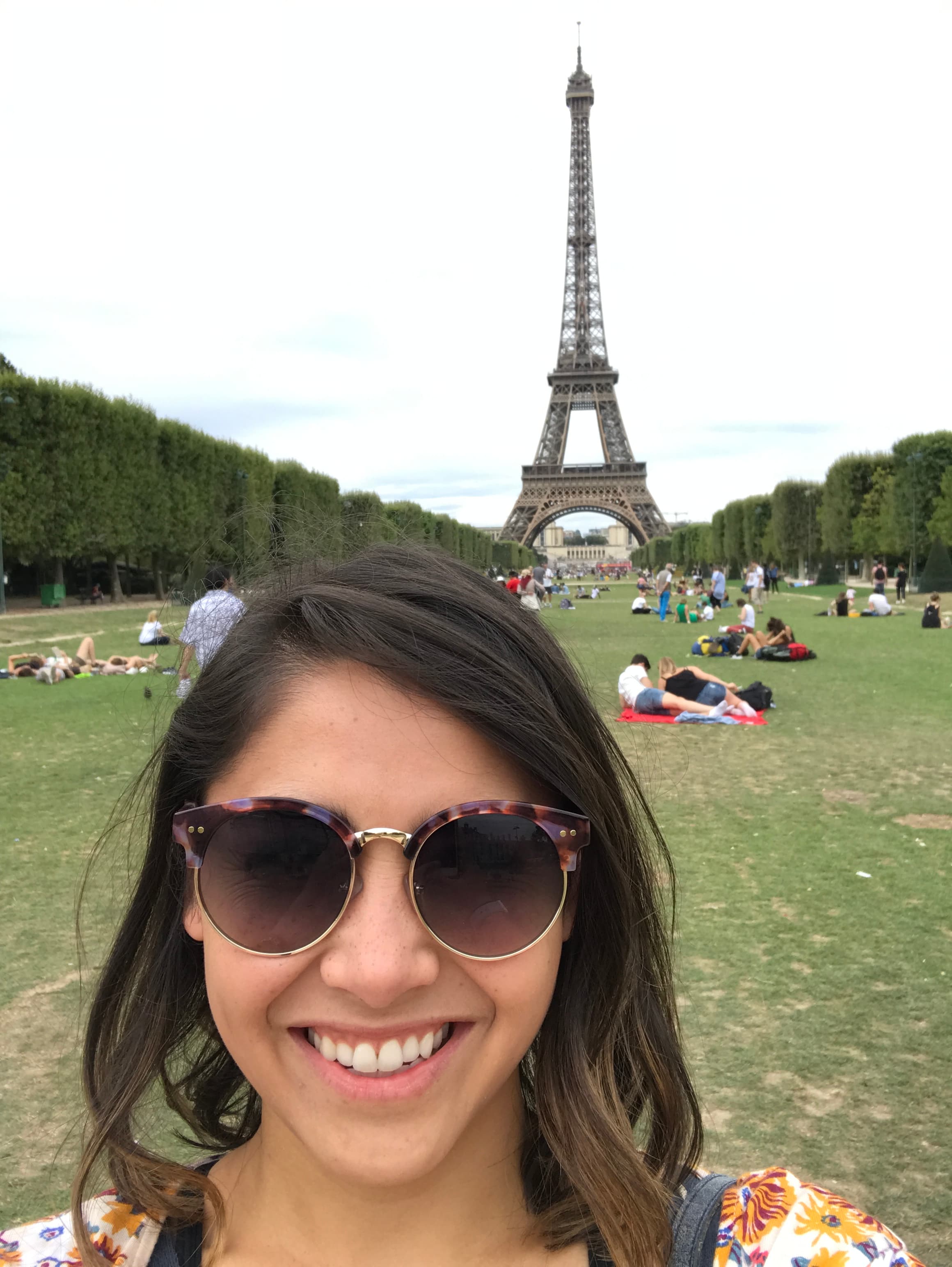 Travel advisor posing in front of a tower