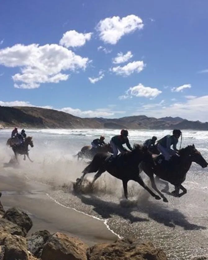 Men racing on horses