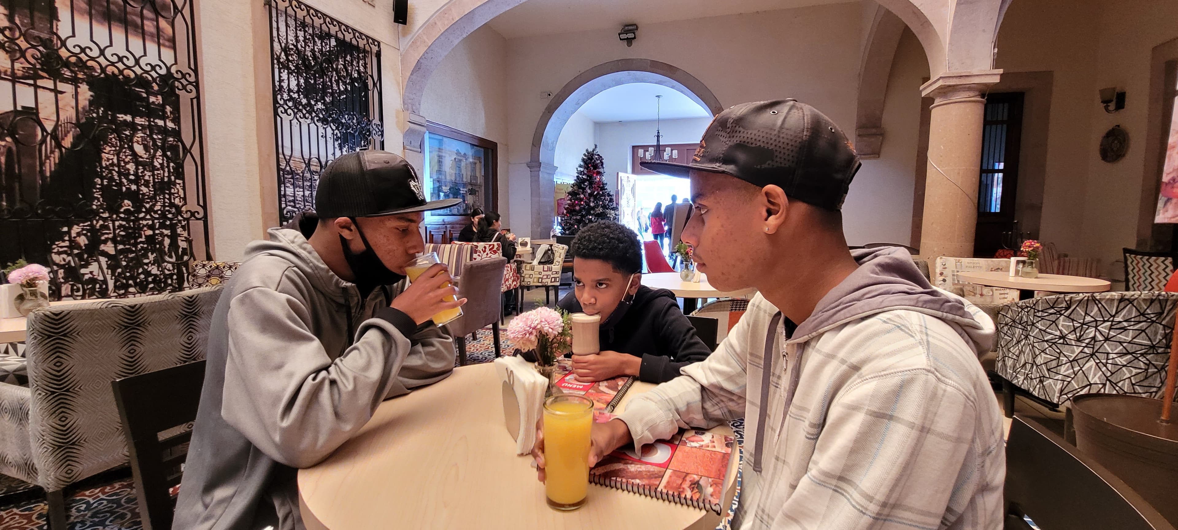 Kids having juices in a restaurant