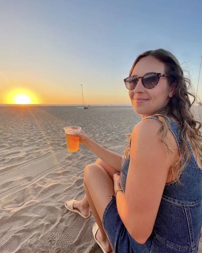 drink on beach by sunset