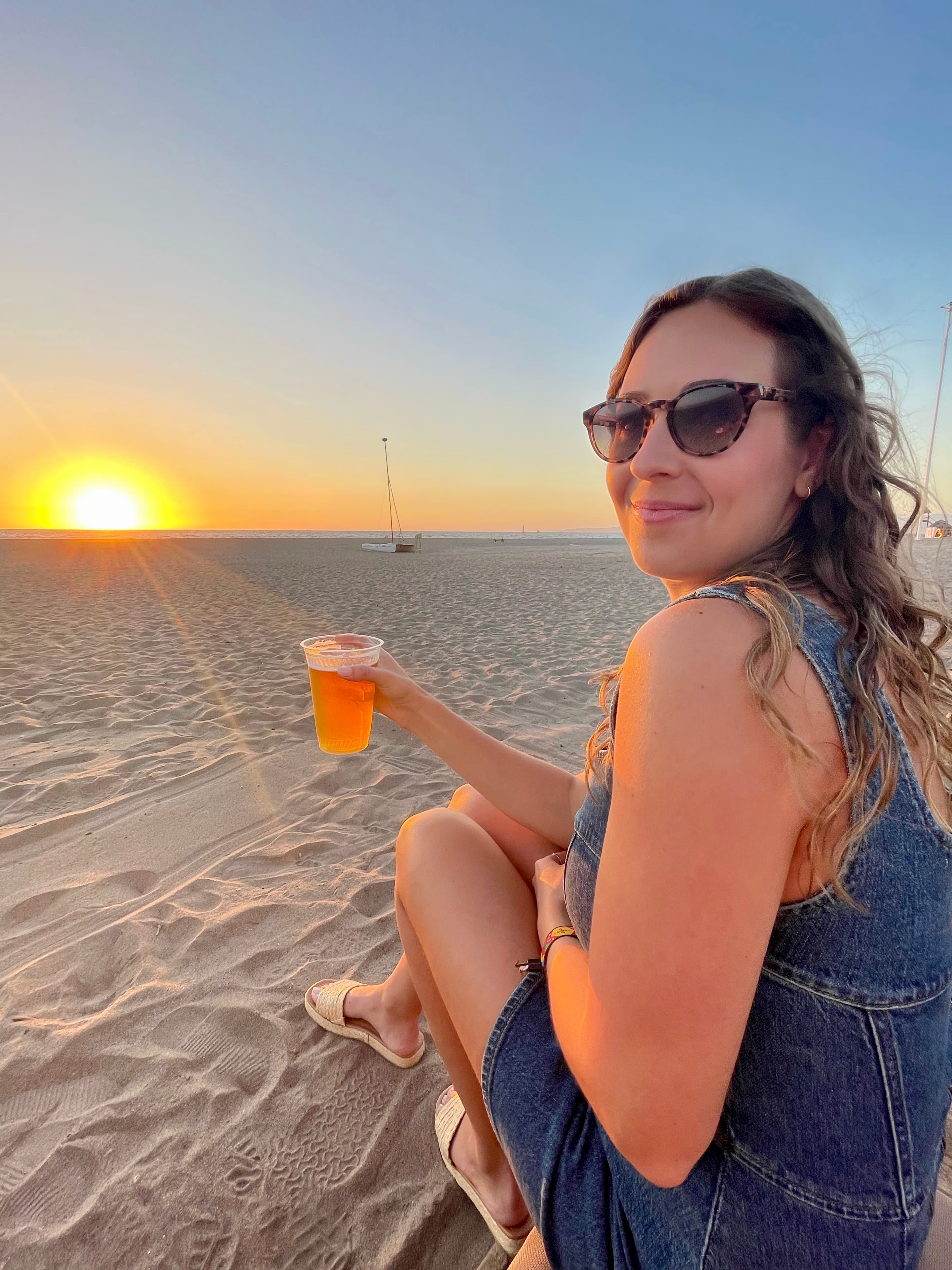 drink on beach by sunset