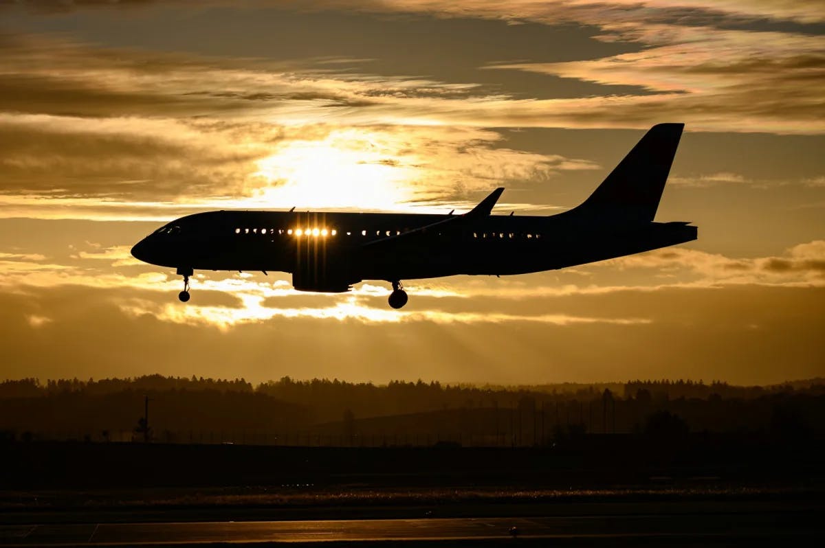 At dusk and bathed in golden light, a passenger get lands at Zurich Airport