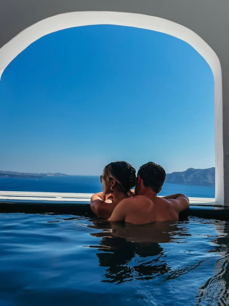 A couple posing in the swimming pool