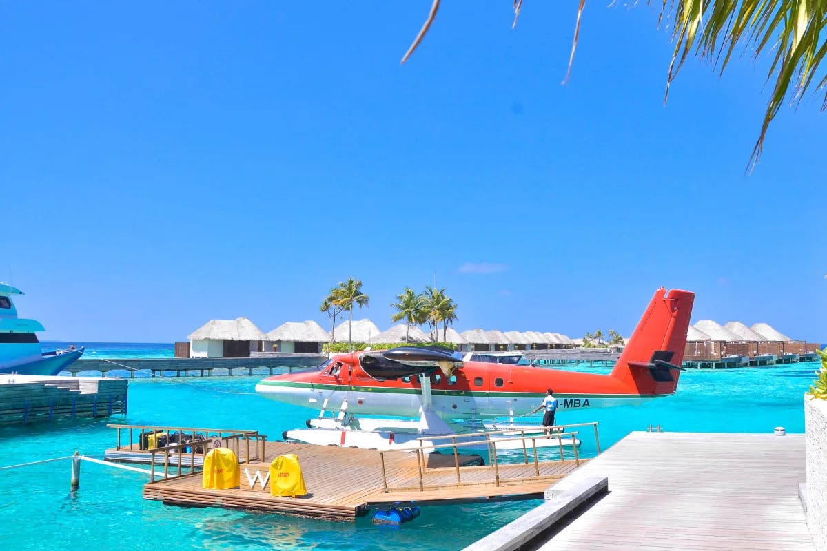 Seaplane on bright blue water during daytime