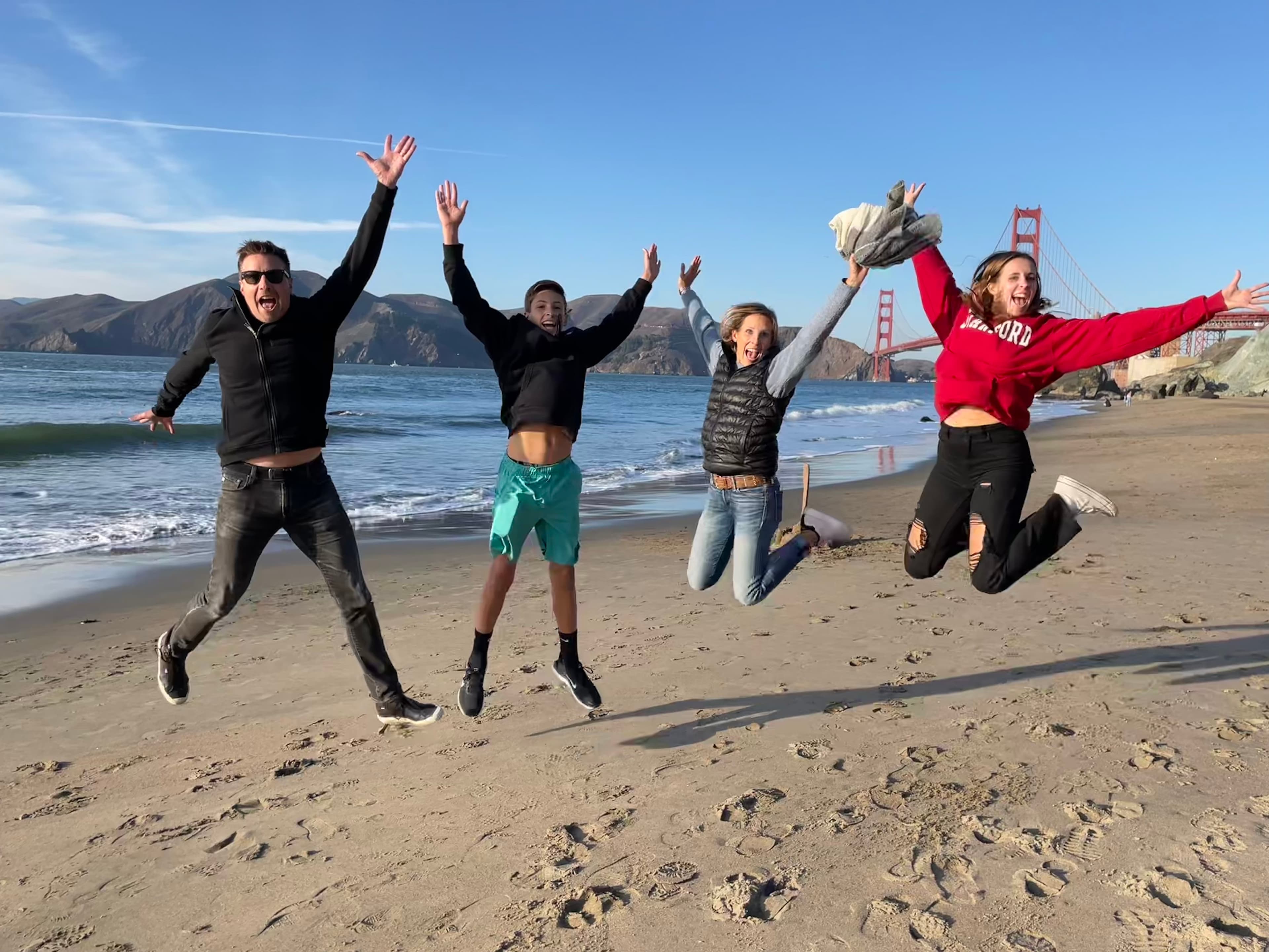 Group of people posing on the seaside