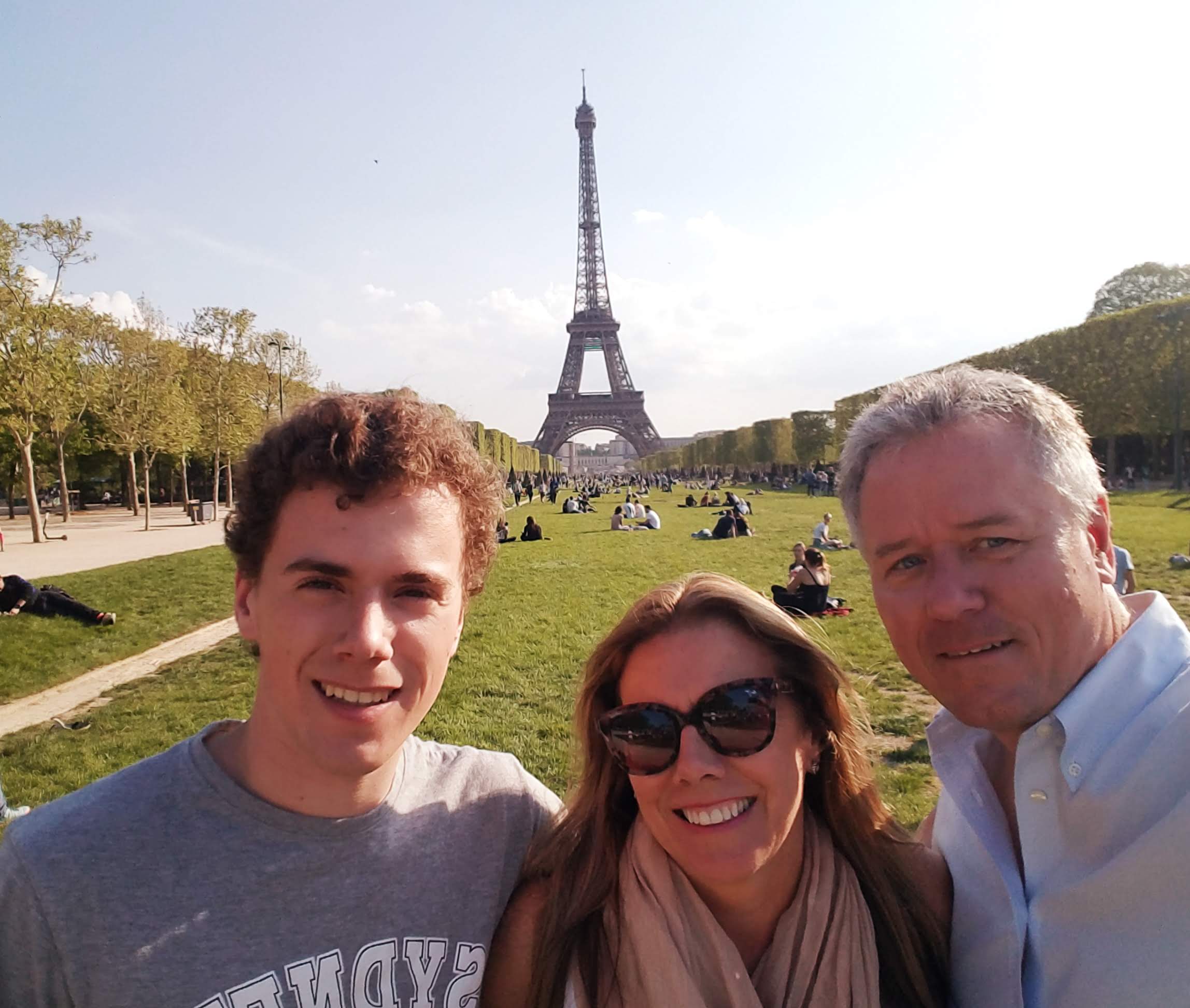 Posing for a family picture with a view of Eiffel Tower