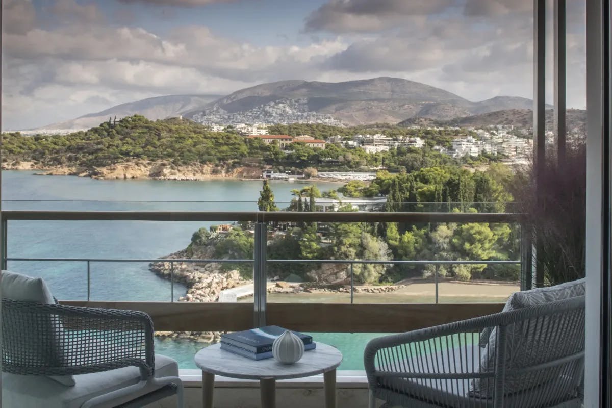 A view of the Athens Riviera an its beaches, forests and homes from the private balcony of a suite at Four Seasons Astir Palace Hotel Athens