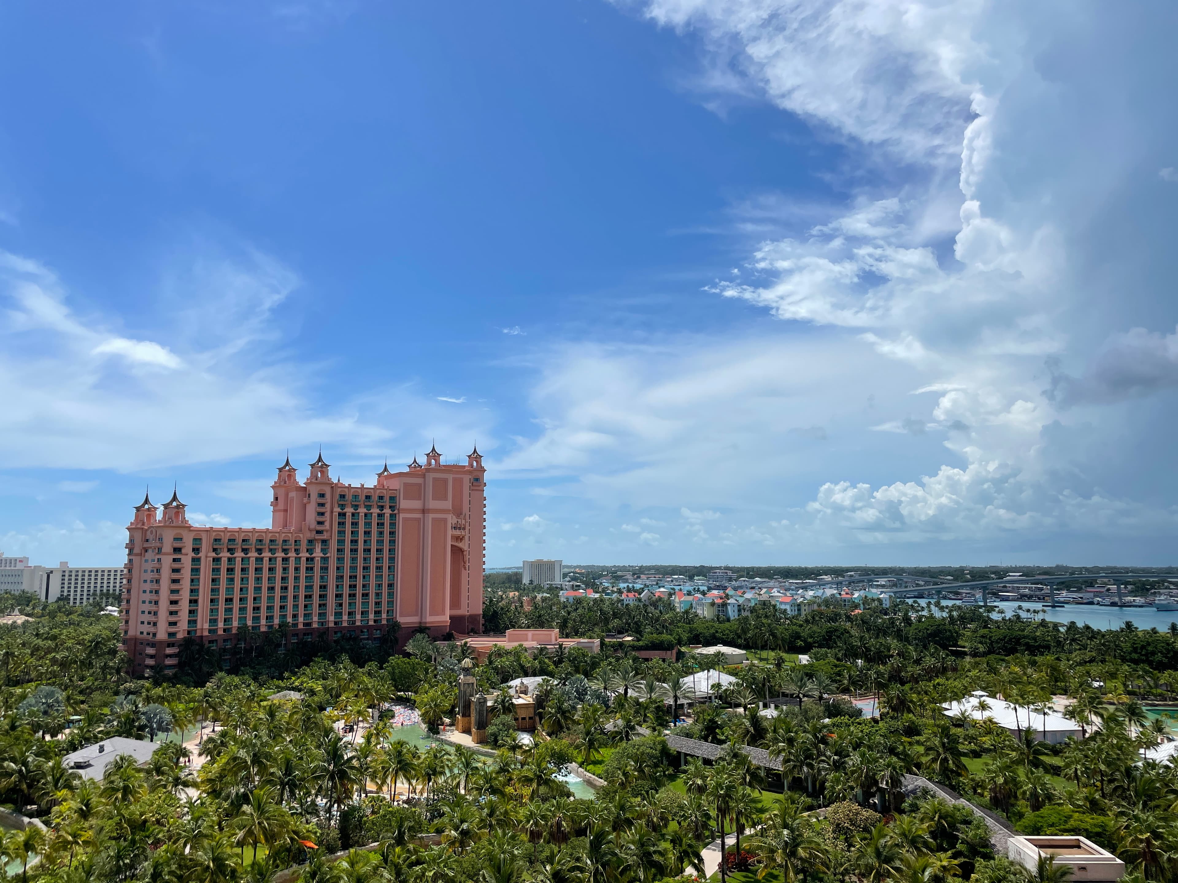 Two kids doing hand stand on sand.