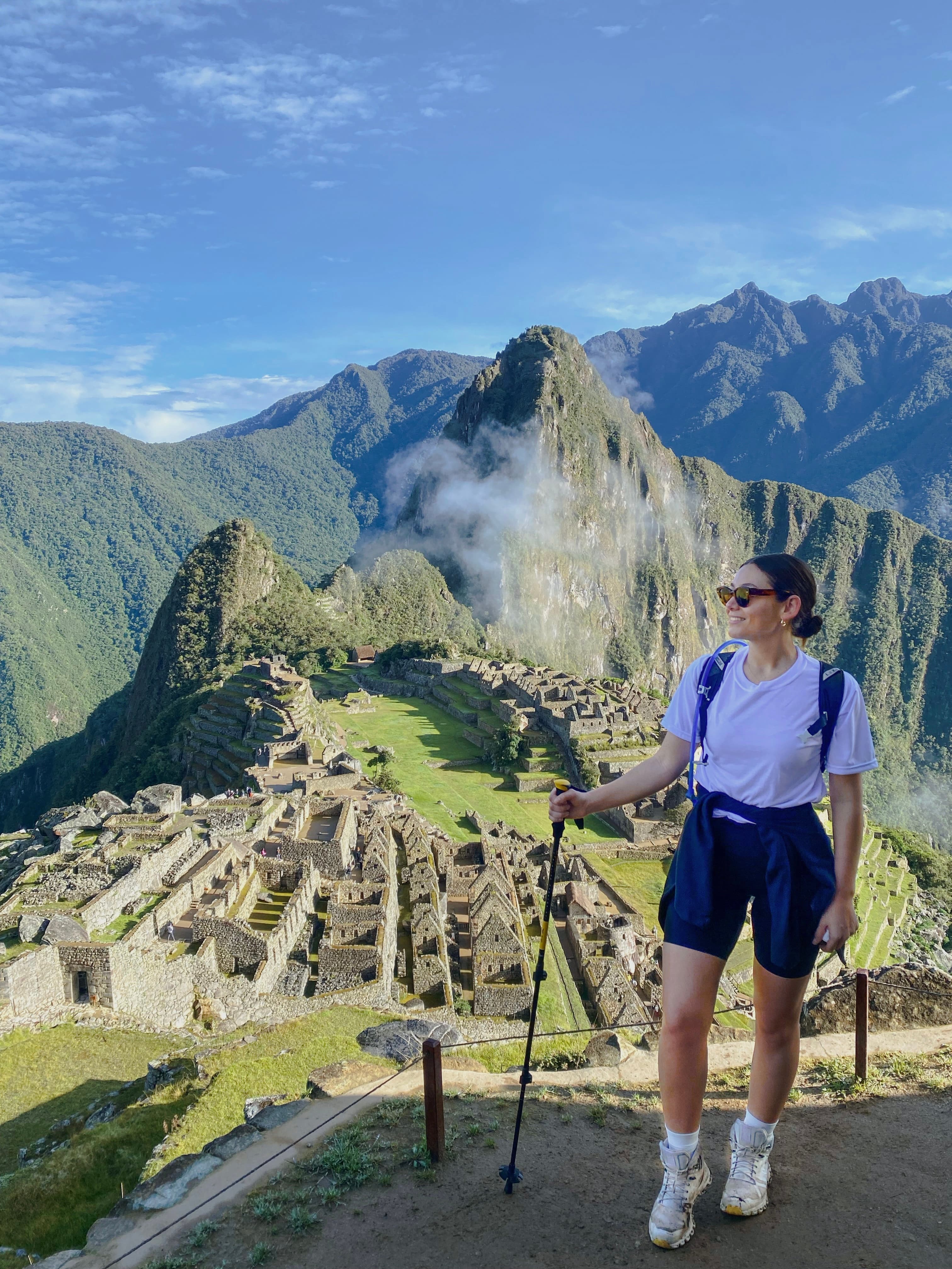 Travel advisor posing in a hilly area