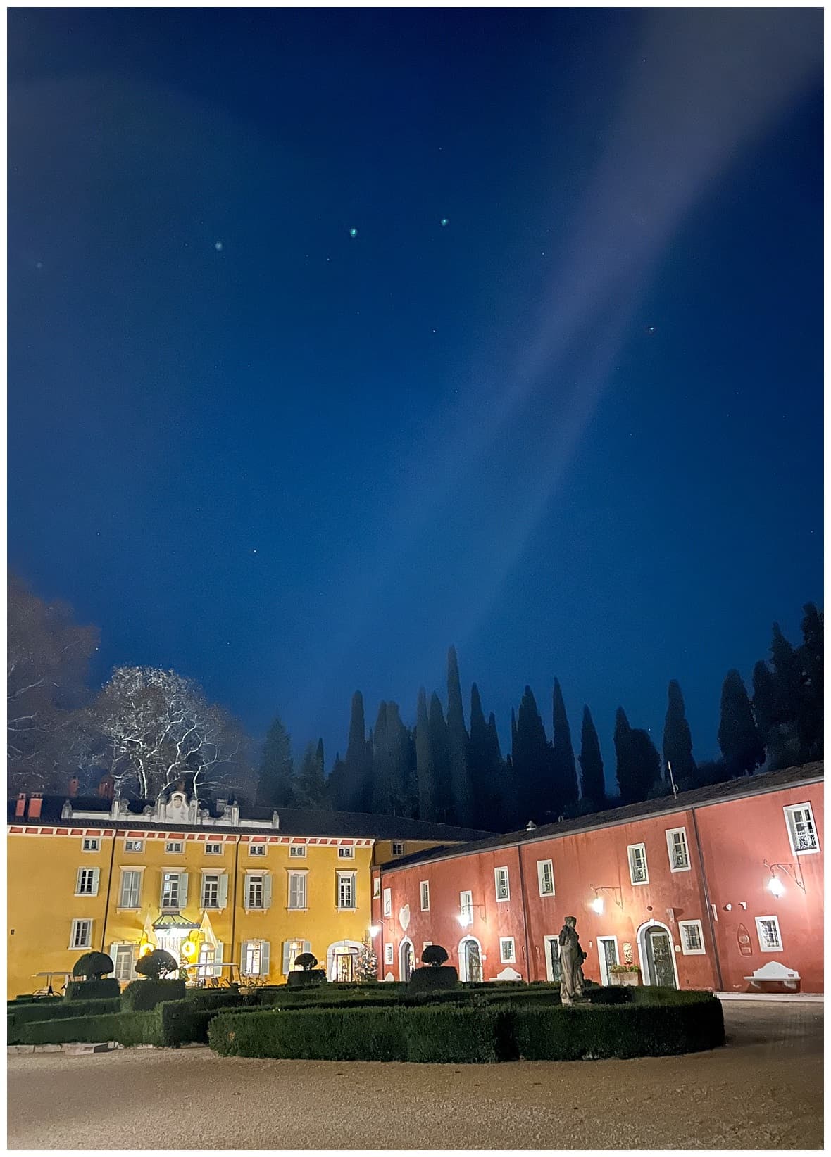 A compound surrounded by colorful buildings.