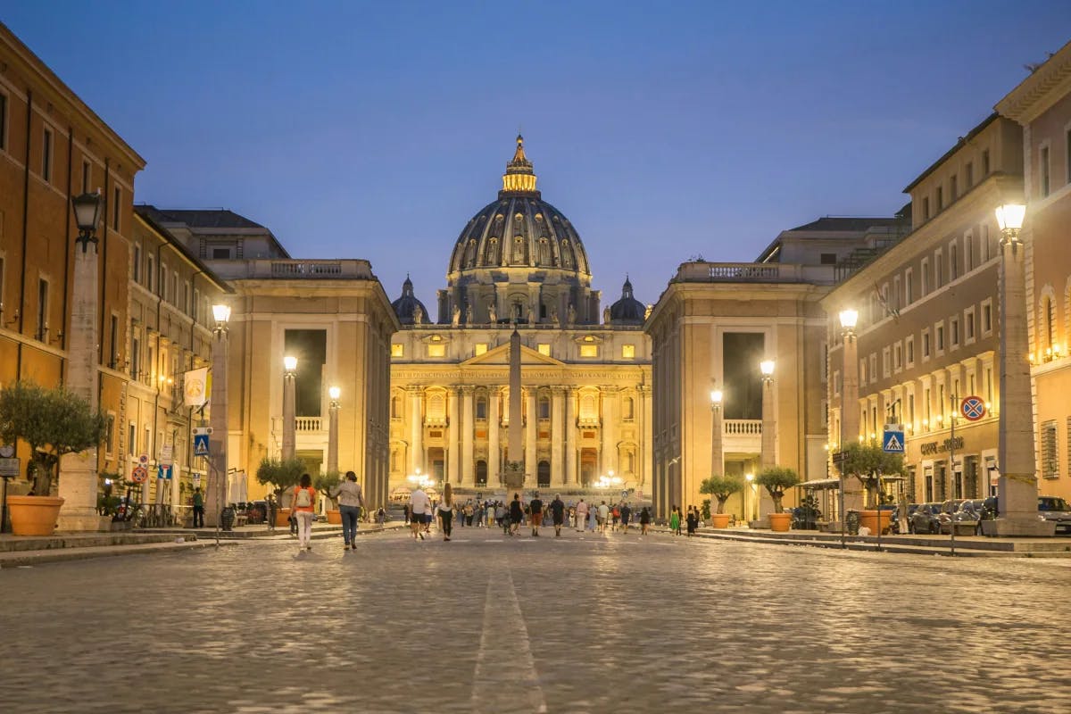 An exterior view of the Vatican City during nighttime.
