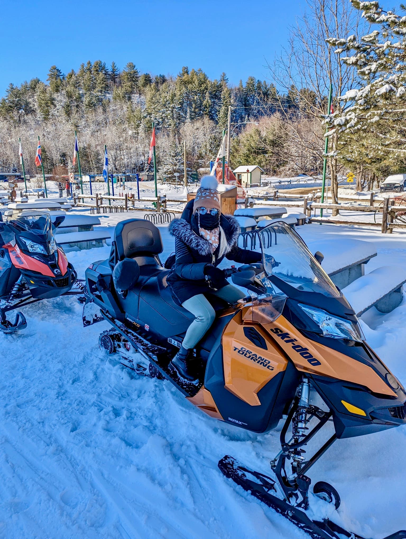 Travel advisor riding a snowmobile.