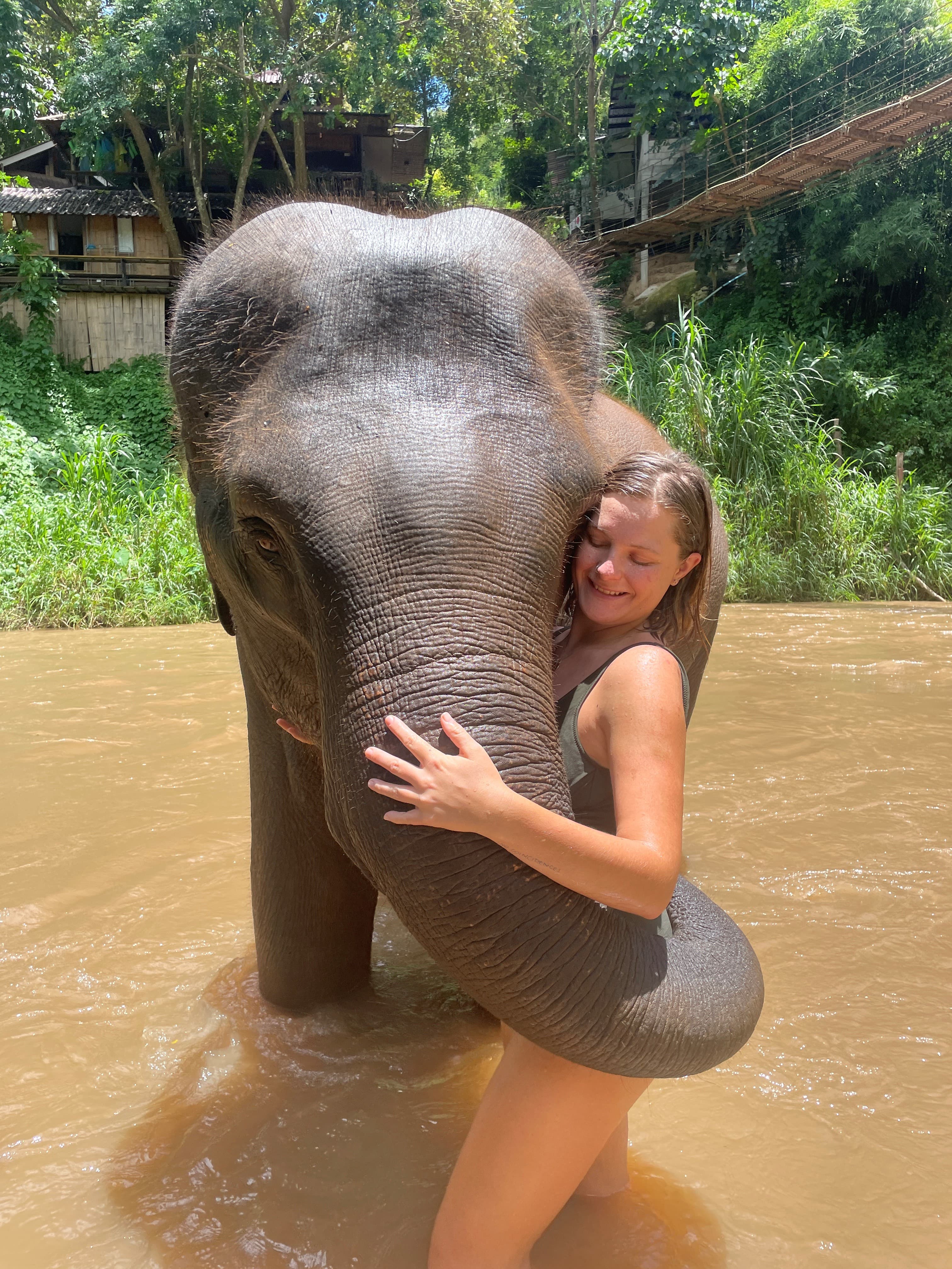 Travel advisor posing with an elephant
