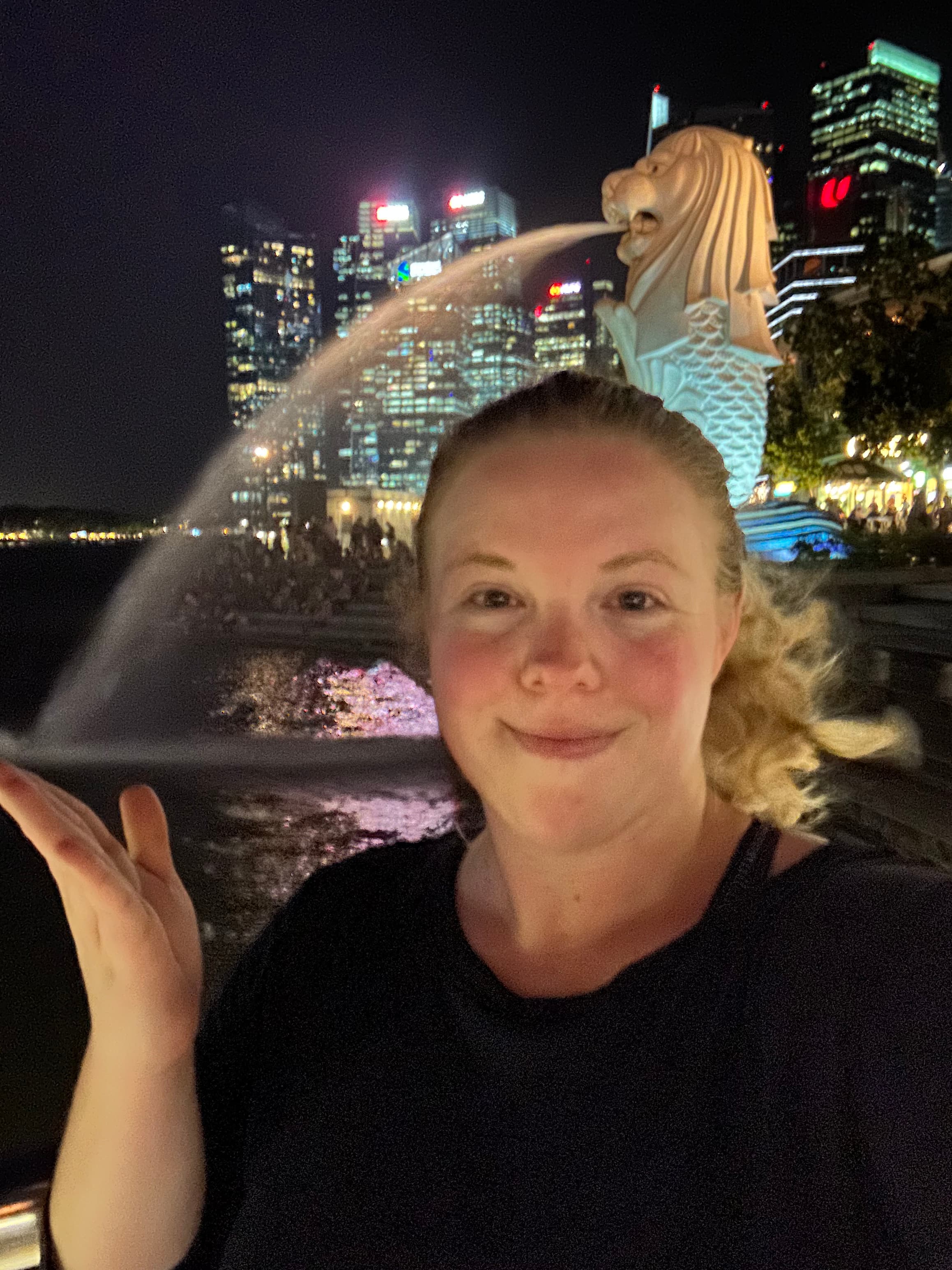 Posing for a photo with a water fountain