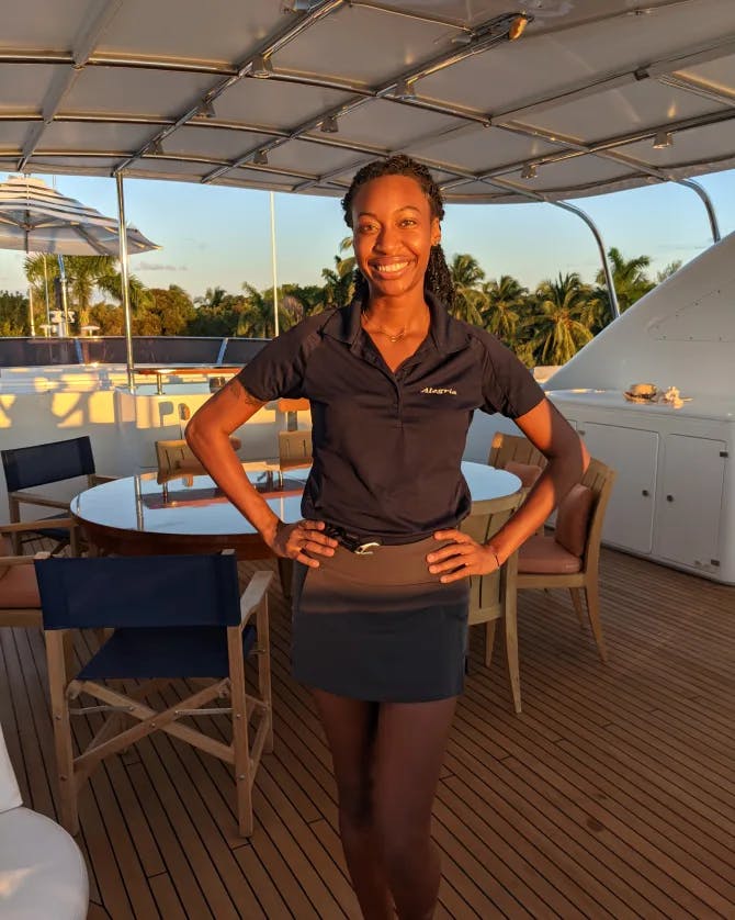 Jazmin Paige in her uniform on a beautiful yacht. 