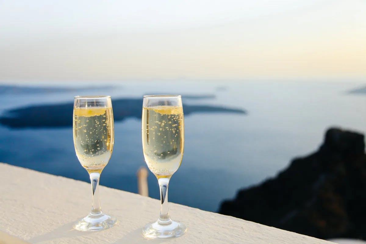 A welcome champagne toast overlooking the sea.
