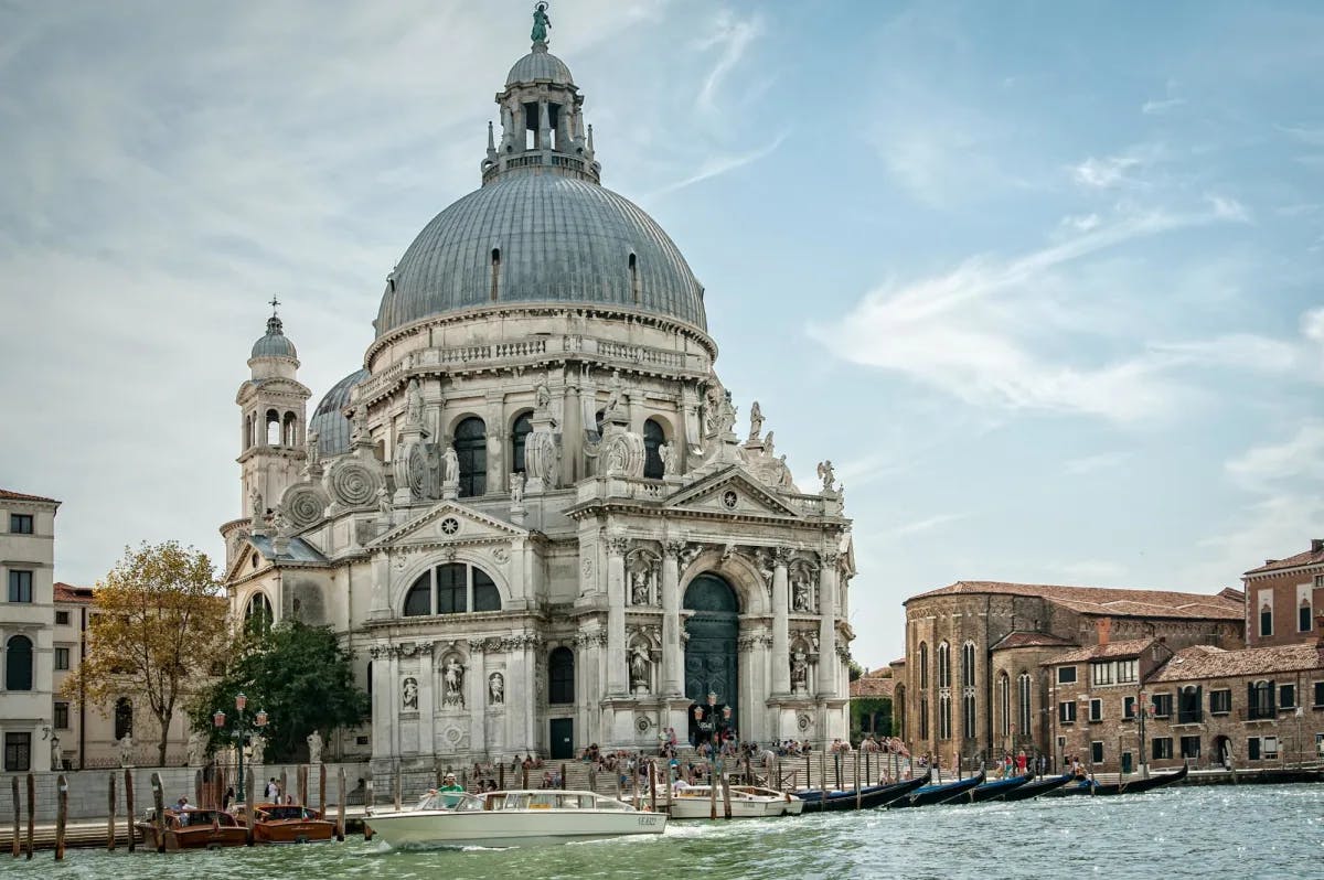 A Venetian cathedral mere steps from one of Venice's famous canals, lined with gondolas and motor boats. (Photo by Mali Maeder)