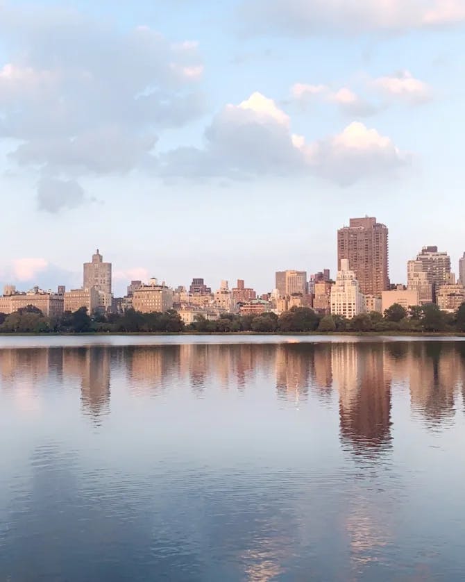 Picture of the Jacqueline Kennedy Onassis Reservoir reflecting the city skyline