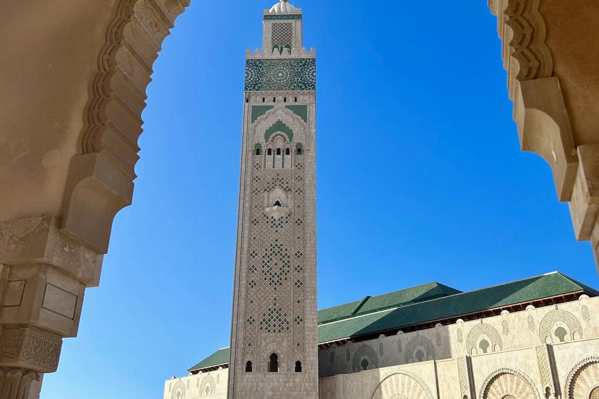 A low angled picture of Hassan II Mosque during daytime.