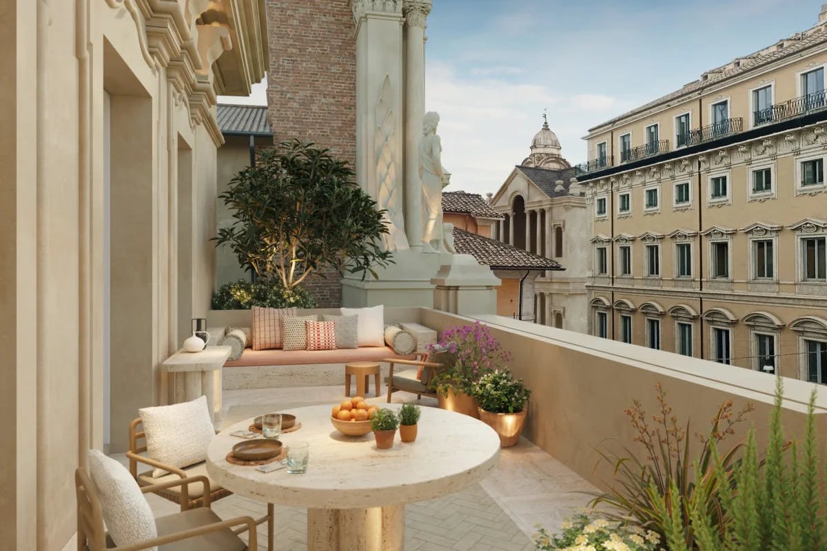 an outdoor terrace overlooks ancient buildings on a sunny day