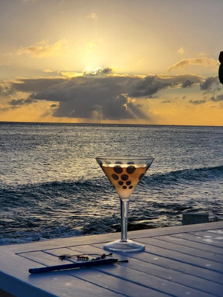 Sea, sky and glass of drink view