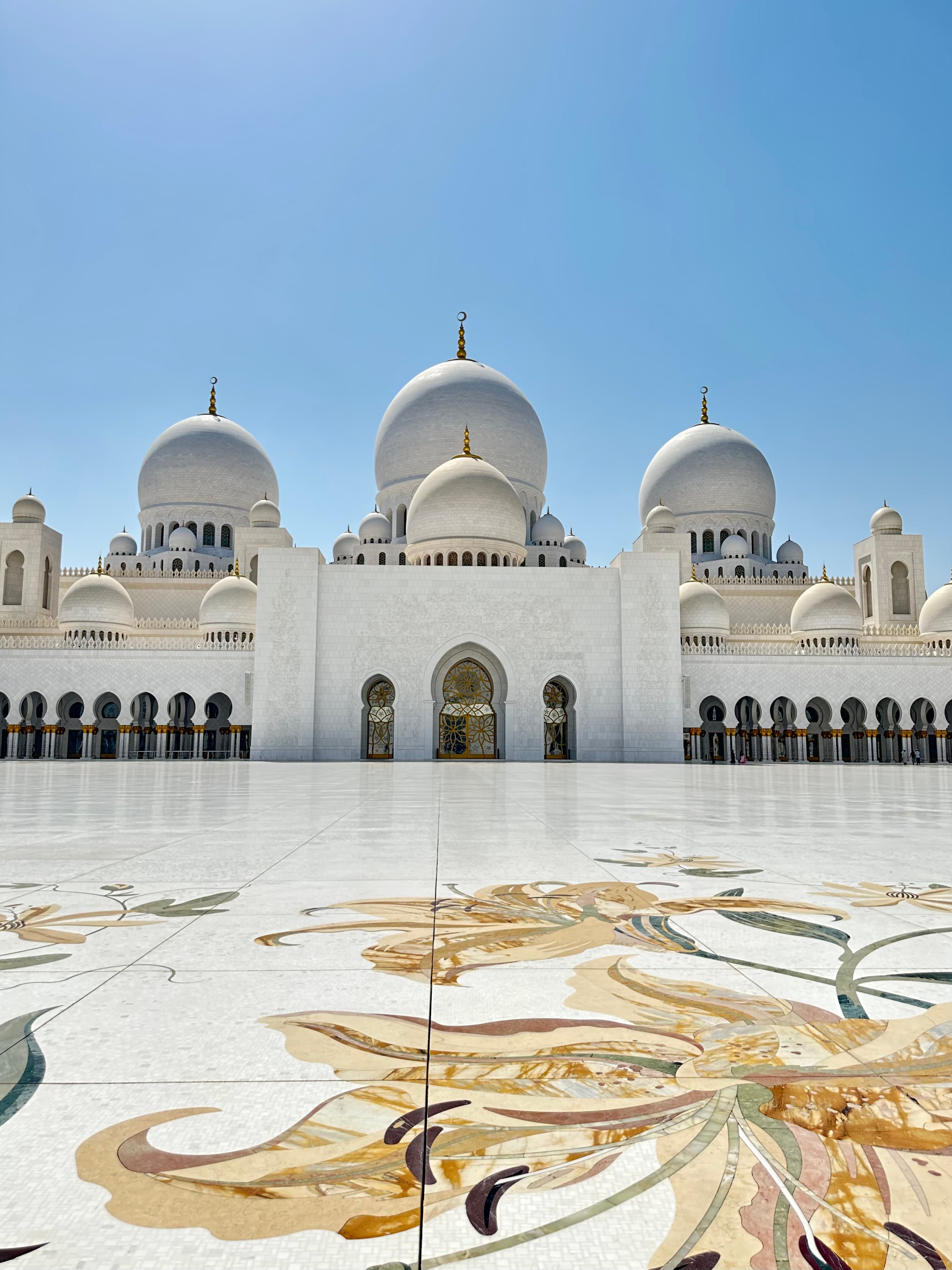 Picture of Sheikh Zayed Grand Mosque with beautiful tiling in front of the building