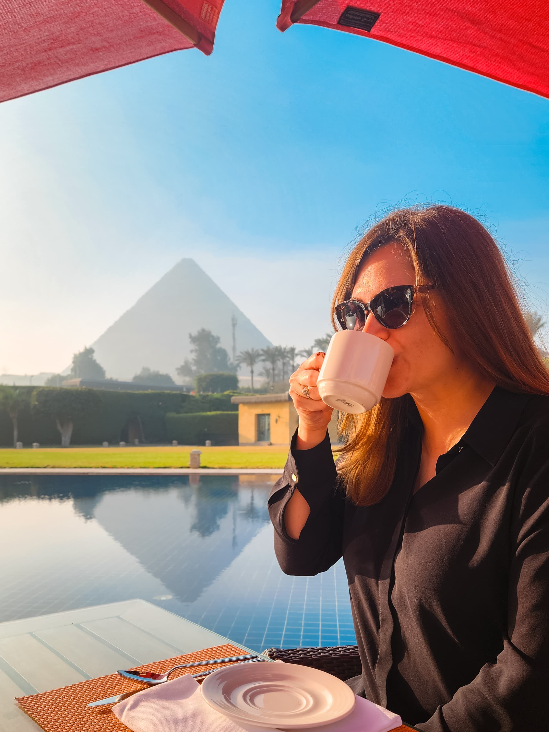 Adviser Pam Hughet having her morning cup of coffee near swimming pool