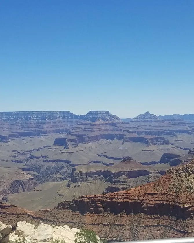 A view of the Grand Canyon National Park from a silver balcony.