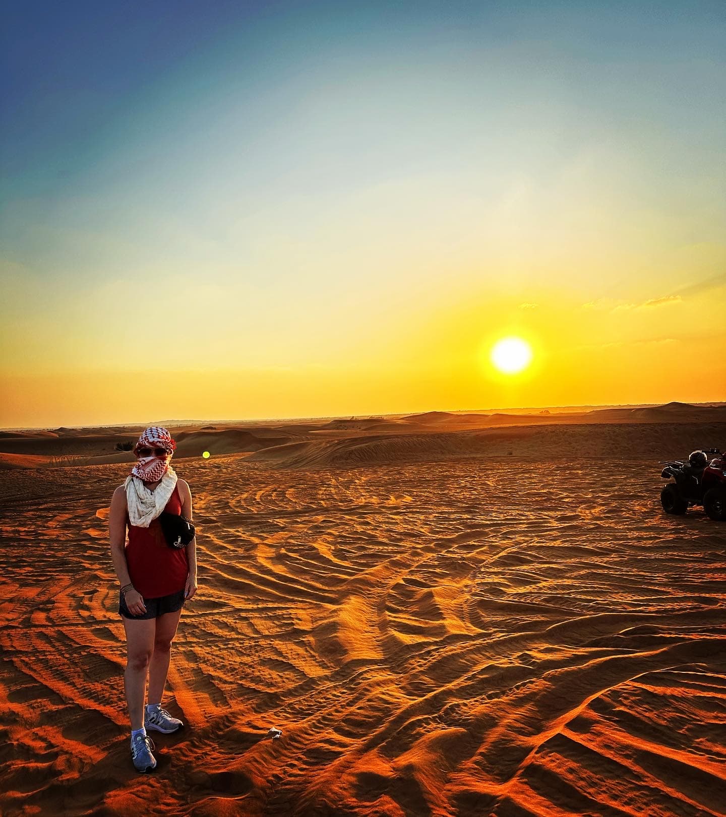 Travel advisor posing in the desert under sunset