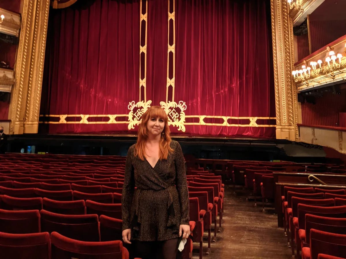 girl standing in the opera house