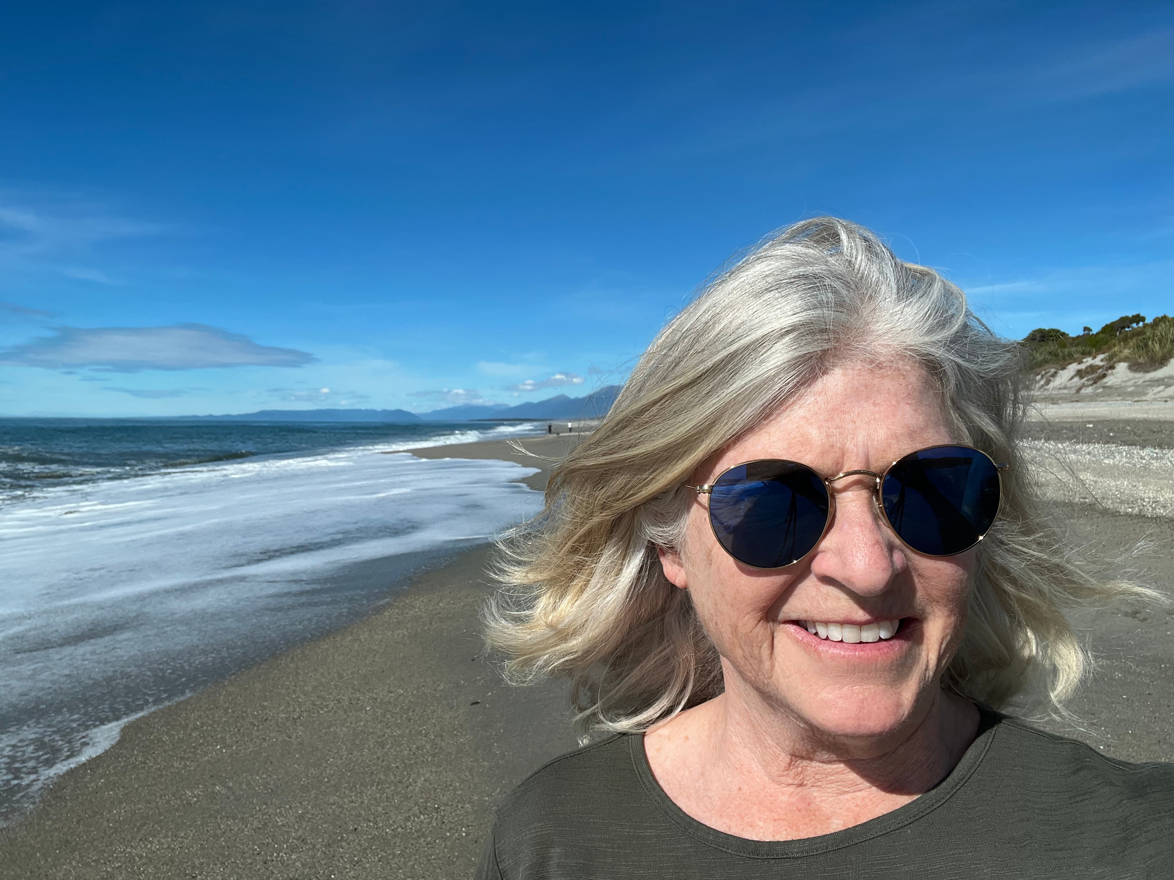 Travel advisor posing on the beach