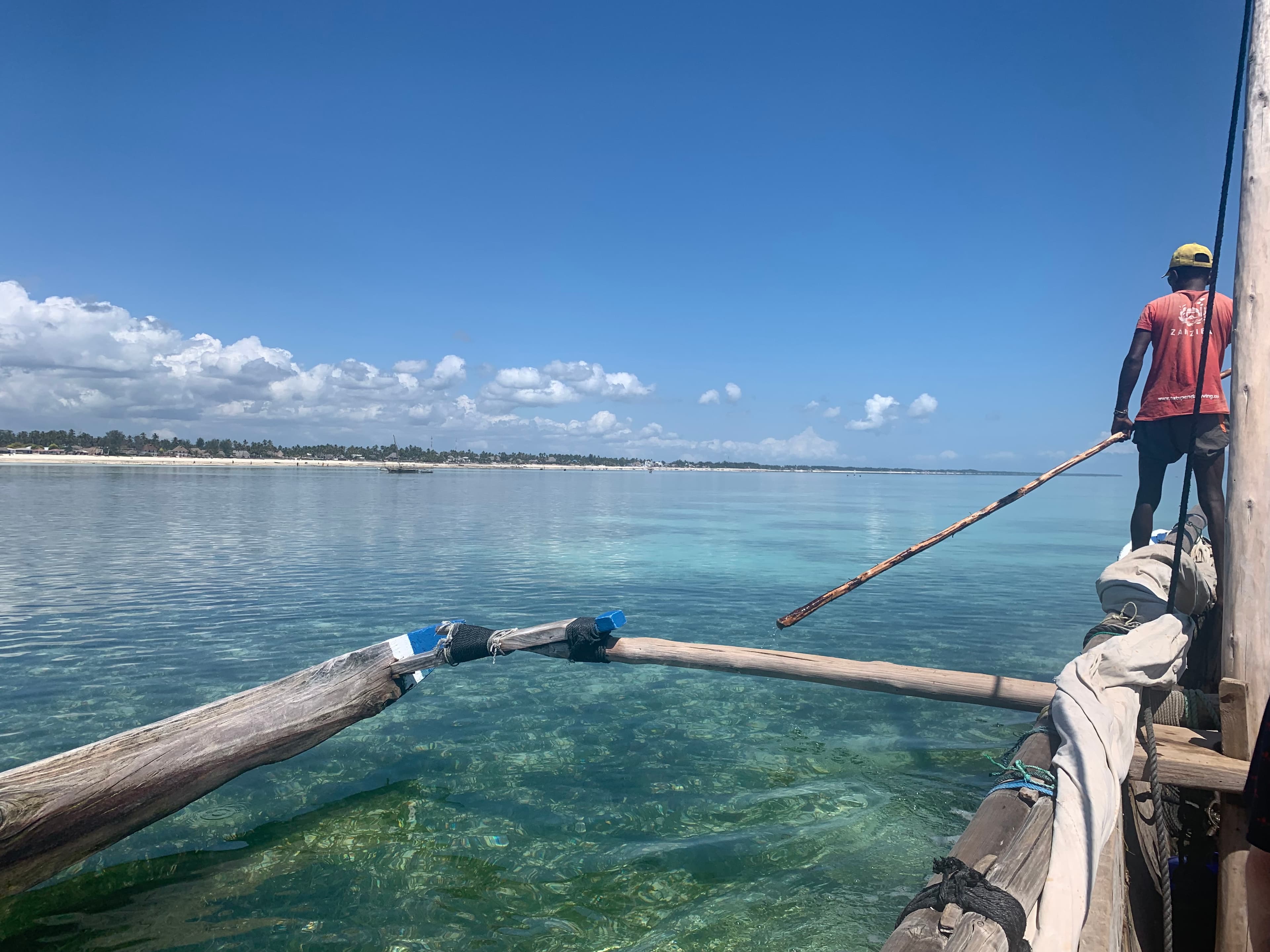 A man steering a boat