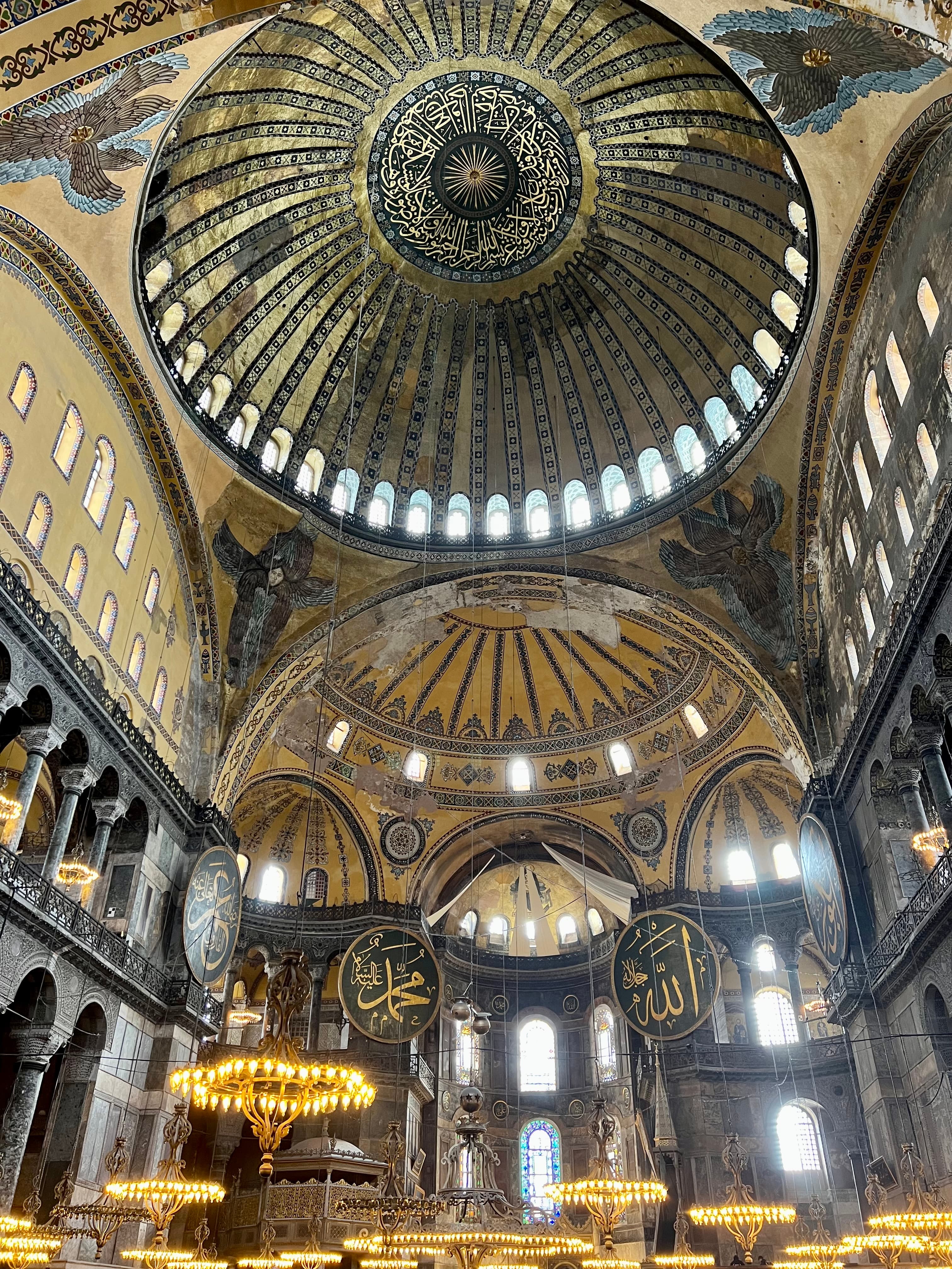 A view inside of Hagia Sophia (meaning Holy Wisdom in Greek), showcasing the Byzantine domes of this holy house of worship.