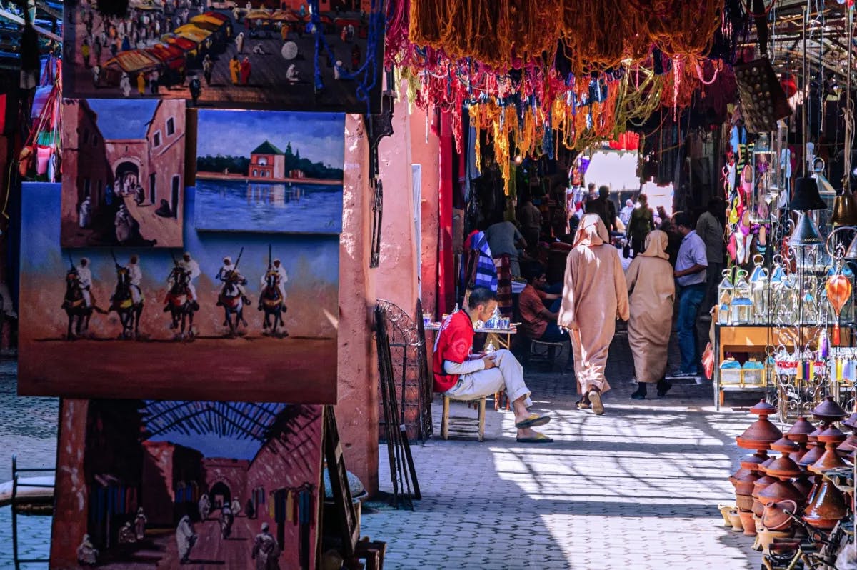 Art, fabrics, pottery, lamps and more fill a tight corridor housing a variety of traders in a Marrakech souk