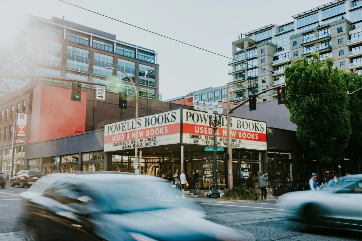 a marquee on a squat urban building reads "Powell's Books."