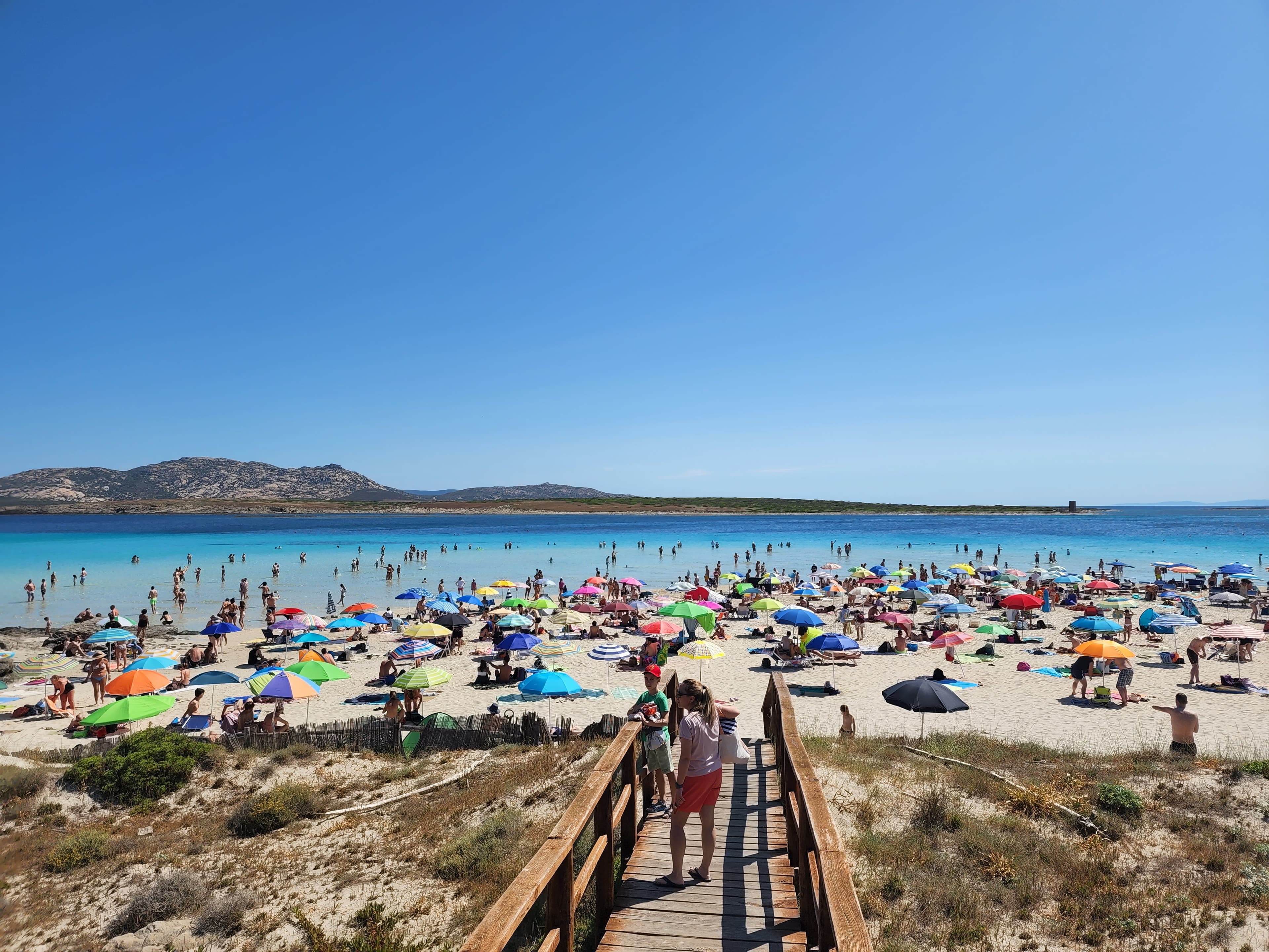 A view of beach with colorrful straw umbrella