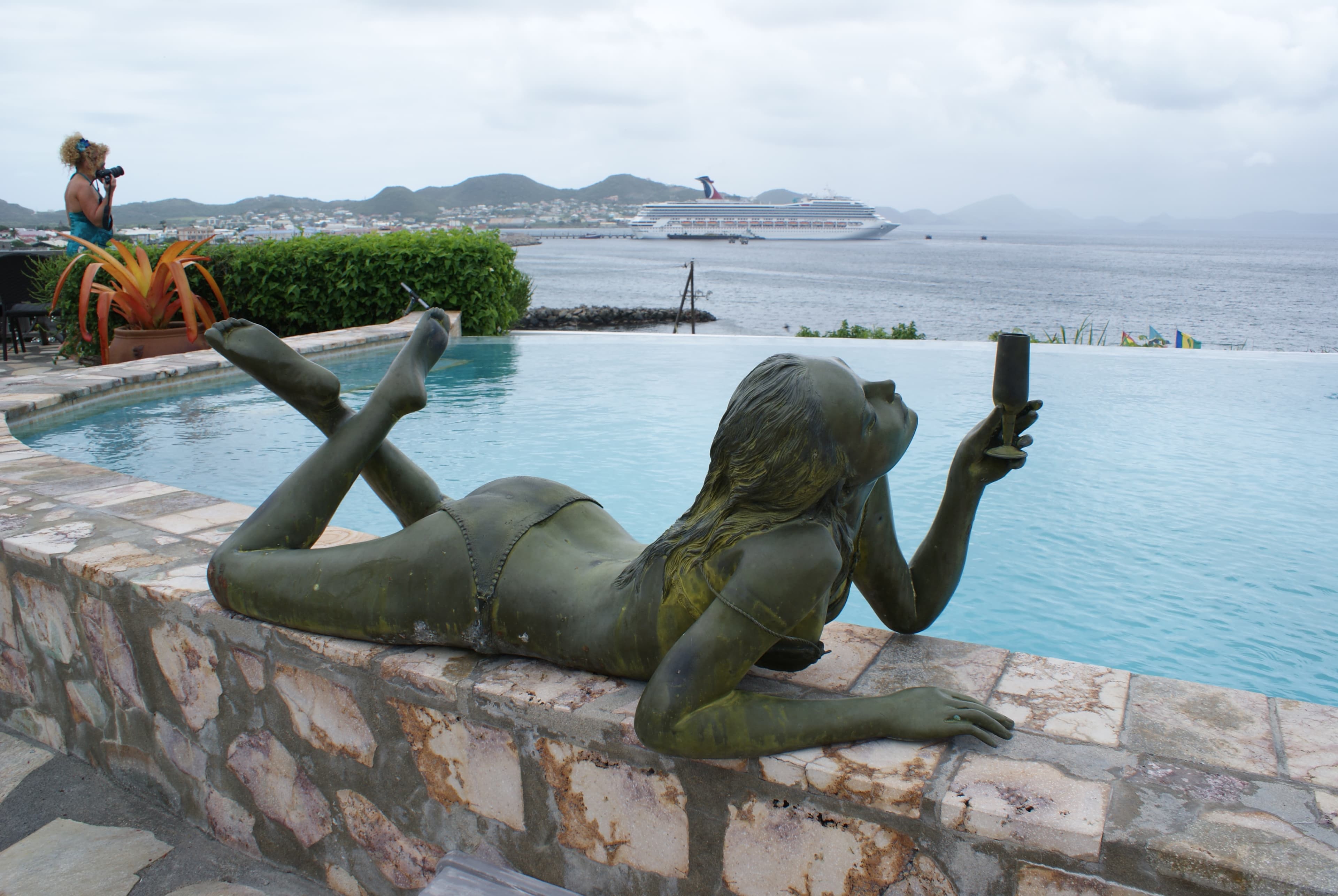 A statue on the edge of the pool