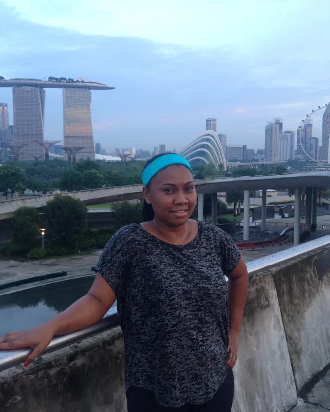 Picture of Lola at Marina Bay Sands Singapore wearing a blue headband and grey shirt 