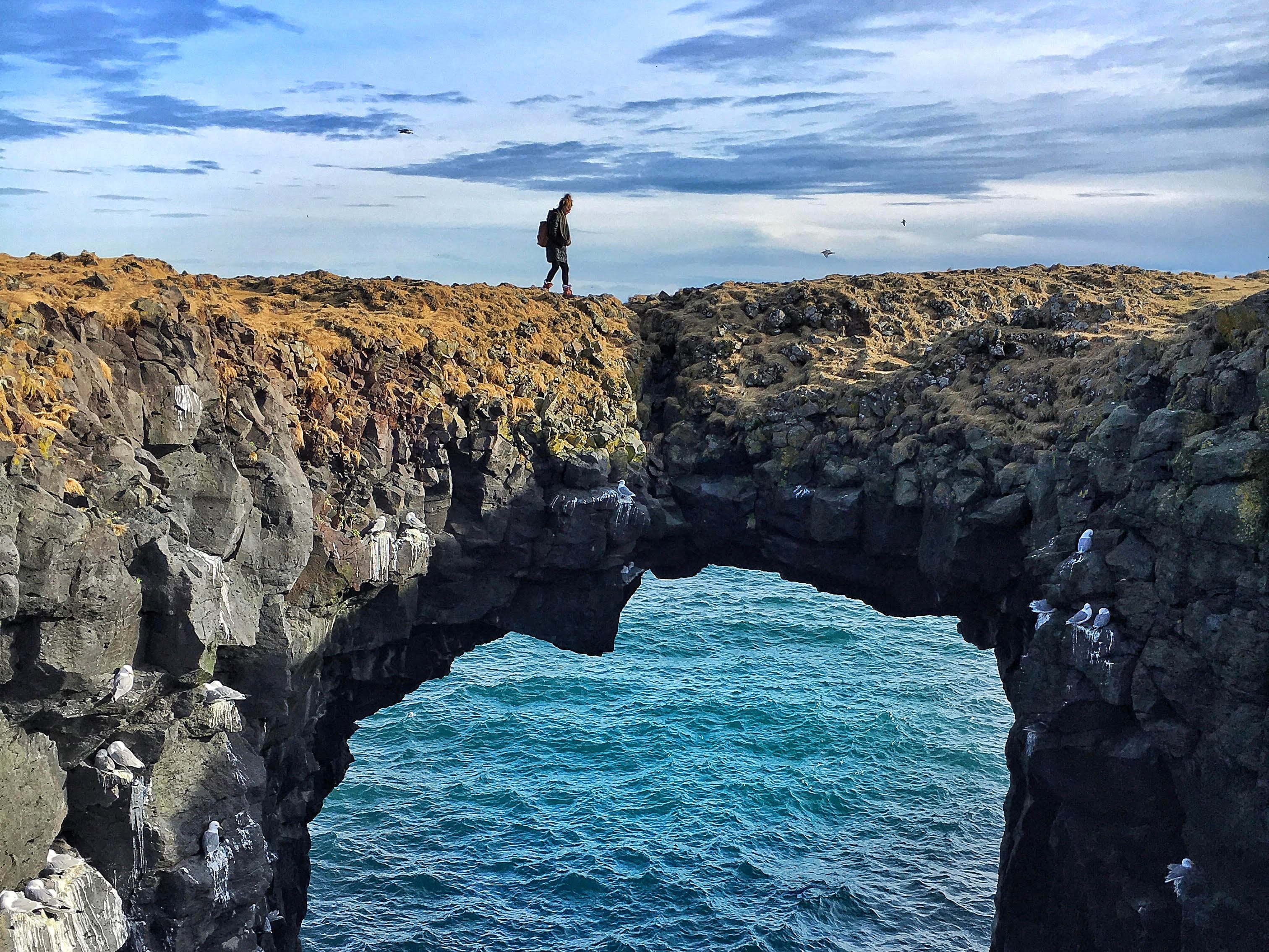 Crossing over the natural rock formation in Iceland