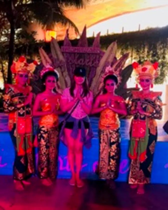 Rogelyn Davis with a group of cultural dancers in Bali.