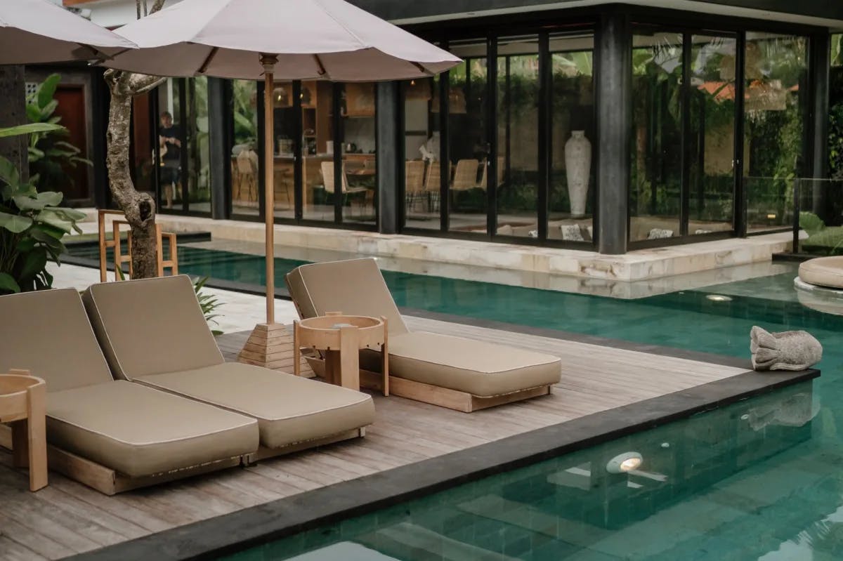 Sharp geometry defines the pool area of a ritzy resort in Bali on a cloudy, quiet day