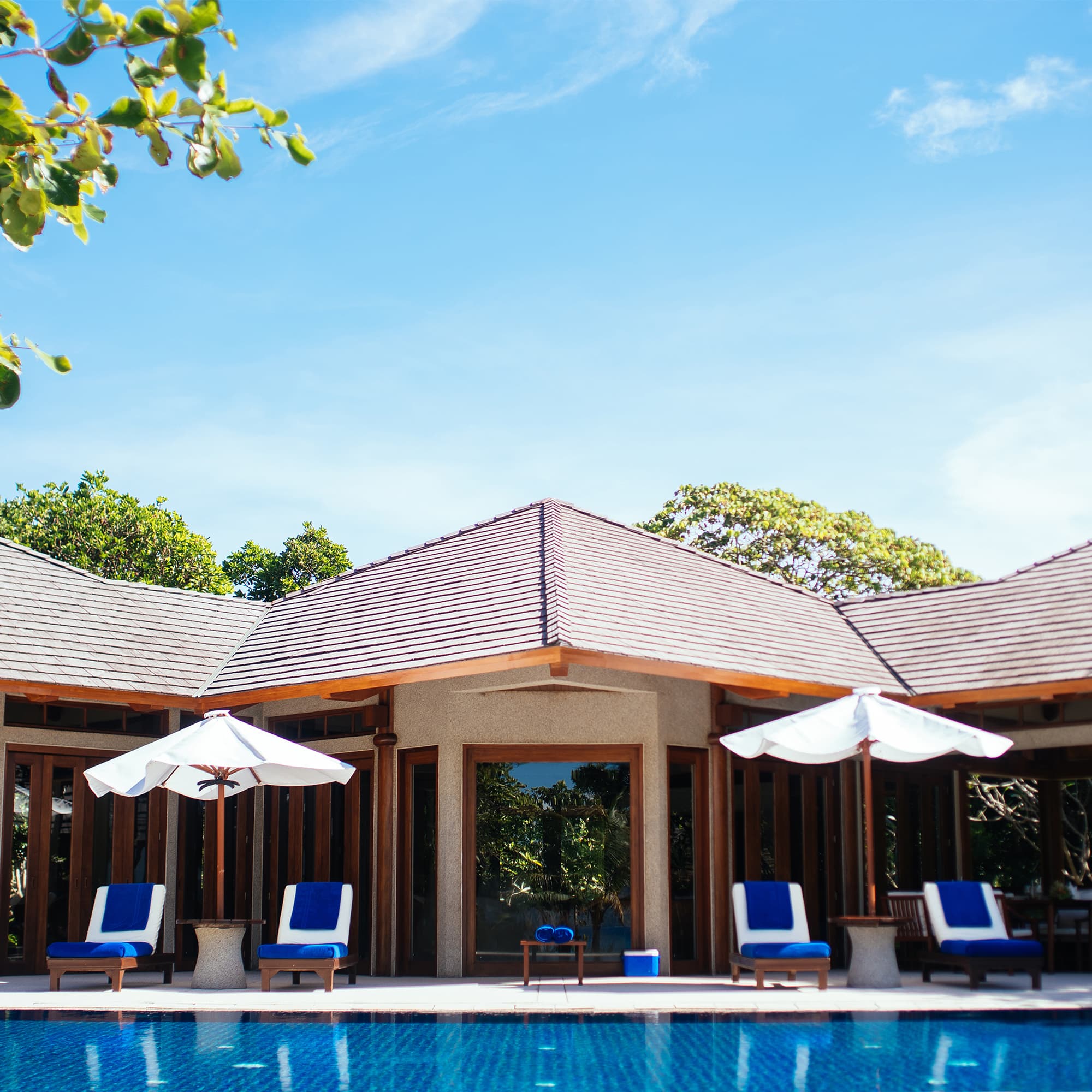 A beautiful view of hut like house with a swimming pool