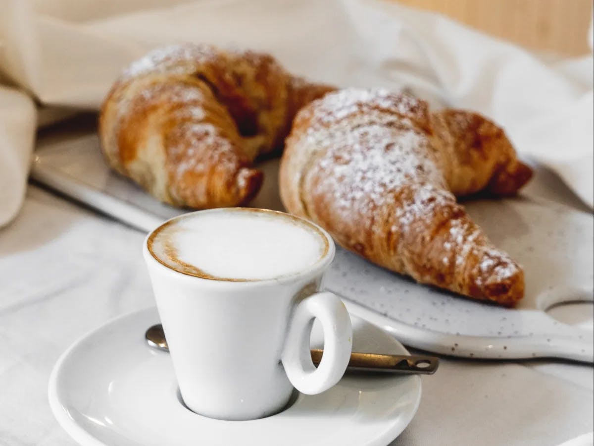 Two croissants with coffee. 