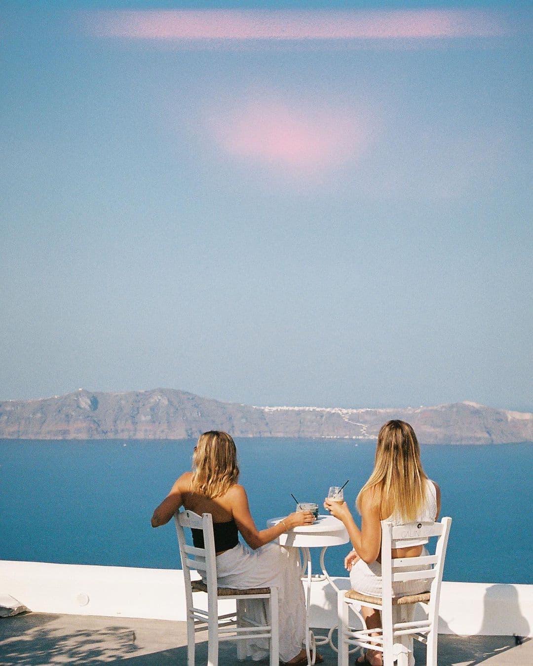 Picture of Carlee having drink with beautiful sea view