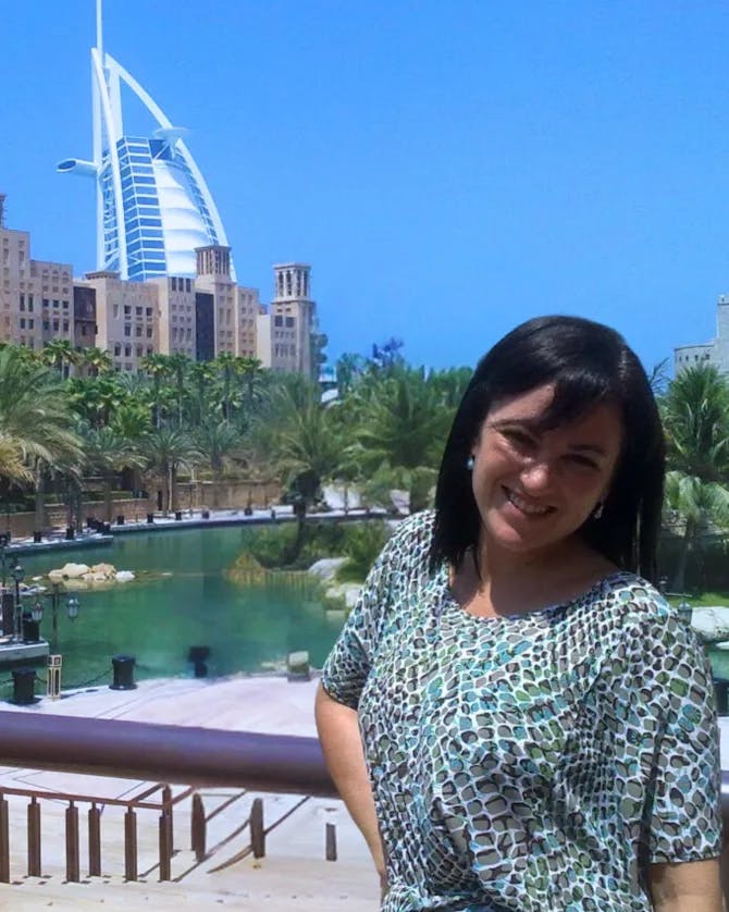 Natasha posing infront of a building in Dubai