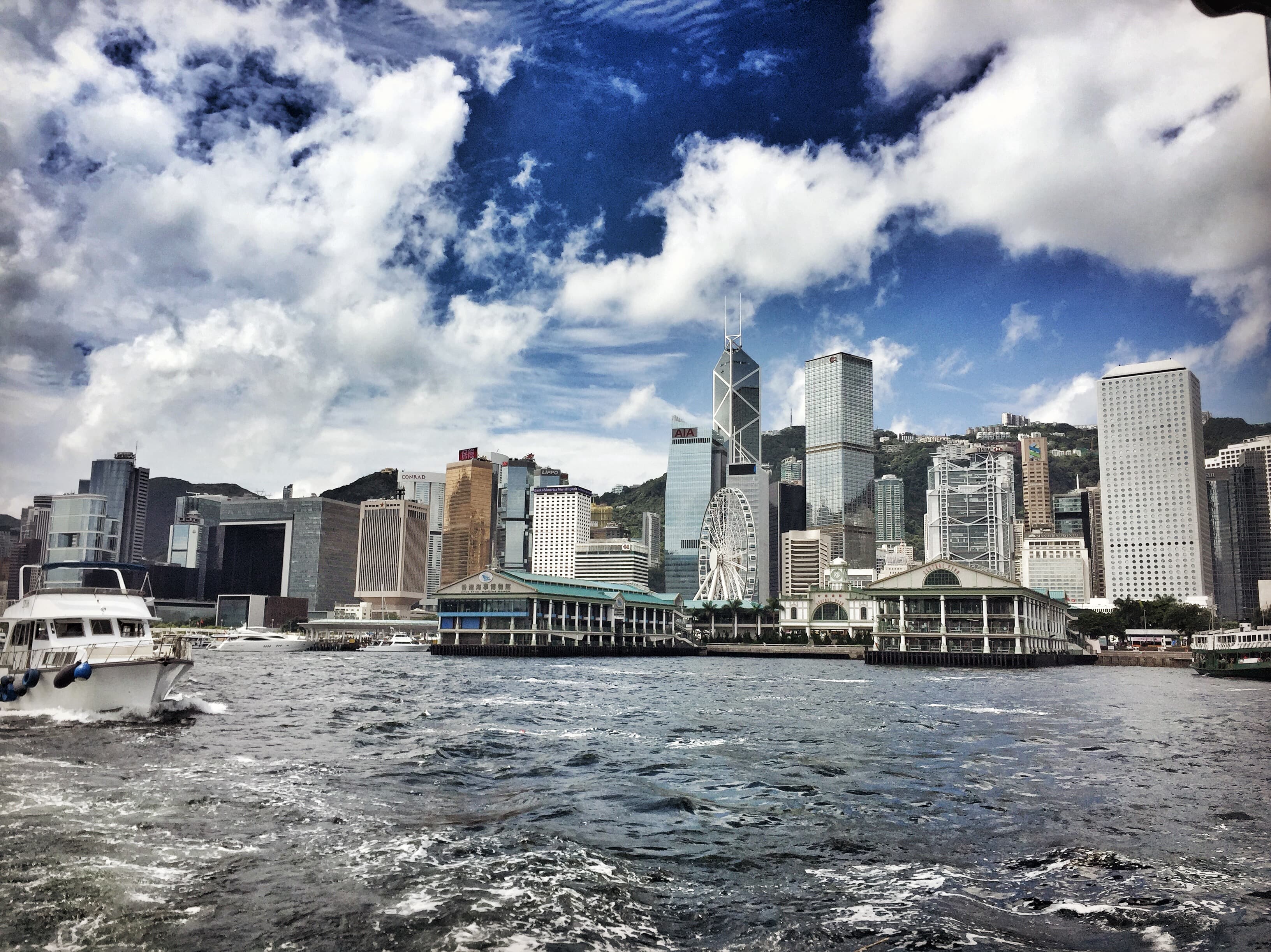 Buildings on the seashore under beautiful sky