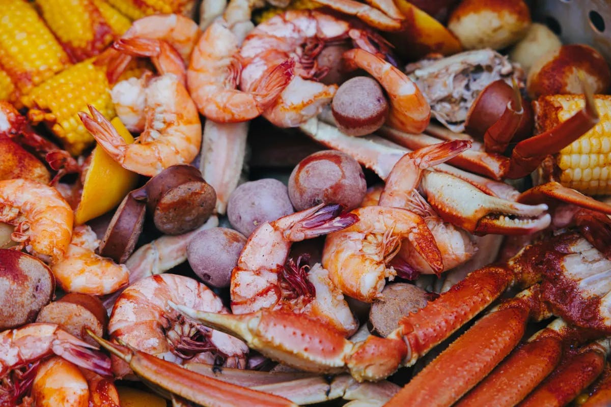 Bright and tantalizing seafood boil with crab, shrimp, and the fixins